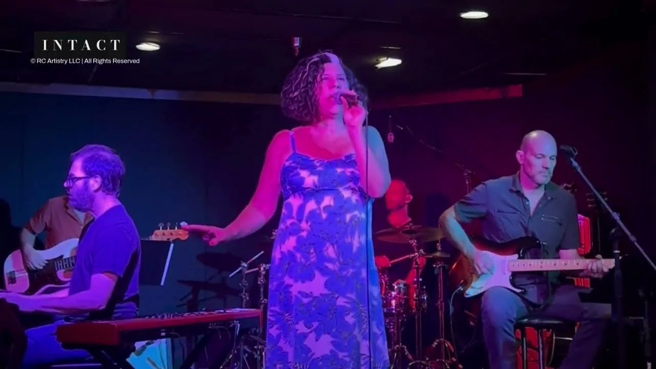 Robin Colucci singing with her live band at the Wine Country Showcase in Solvang
